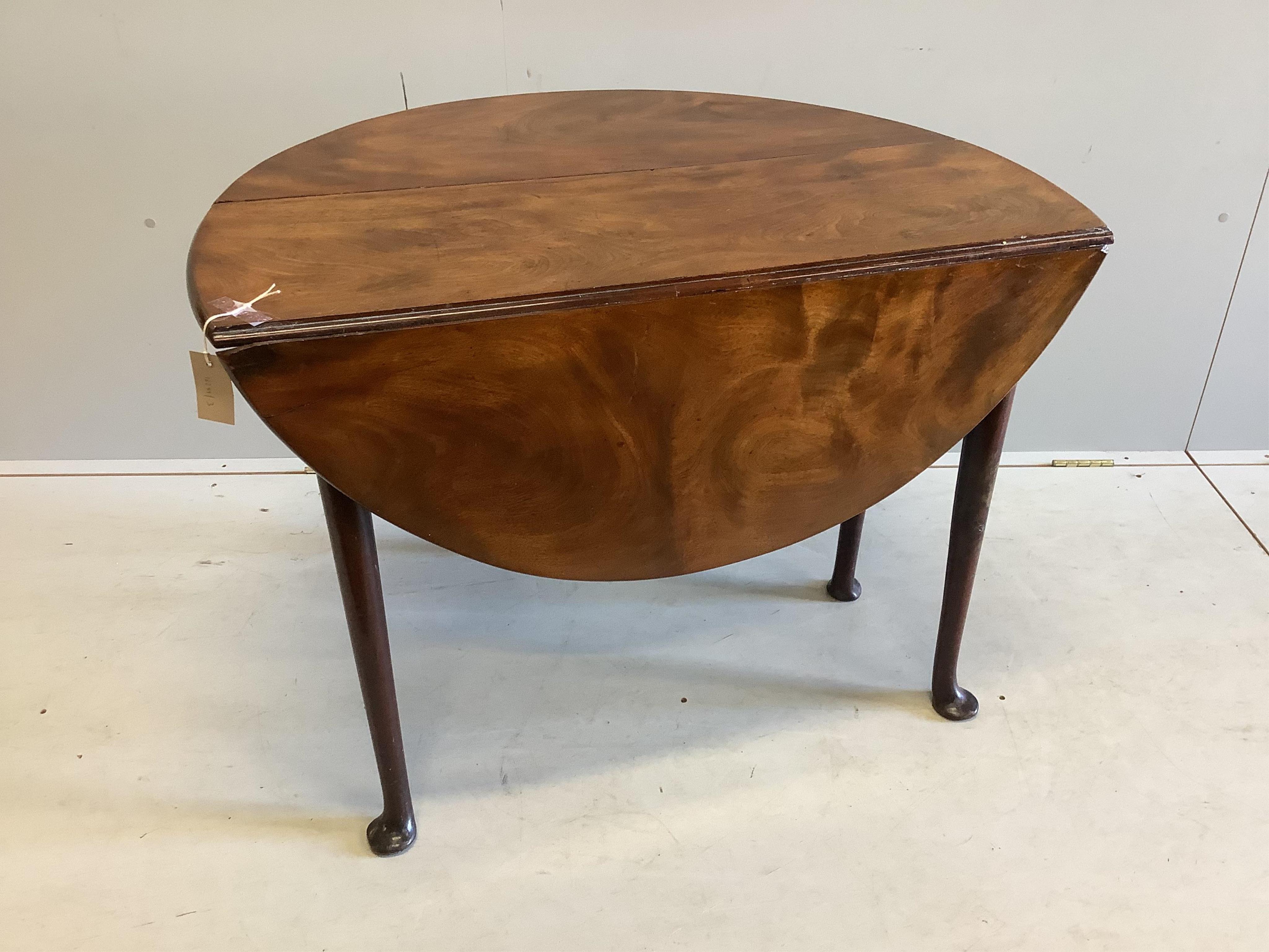 A small George III mahogany drop leaf pad foot table, width 103cm extended, depth 94cm, height 69cm. Condition - fair to good